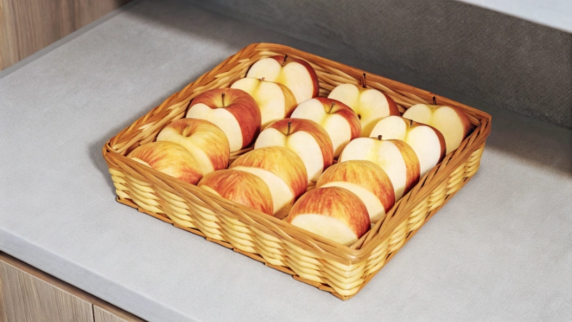 Basket filled with fresh EverCrisp apples showing their distinctive red coloring and crisp appearance